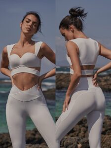 Show off your confidence with the Women’s Cutout Corset Sports Bra – Fixed Cup Fitness Tank Top with V-Legging. This unique 2-piece set features a corset-style sports bra with elegant cutout details and fixed cups for structured support and shaping. The tank top design offers a sleek fit that enhances your form while keeping you comfortable during every move. Paired with V-waist leggings, this set defines your waistline and highlights your natural curves. The breathable, stretchable fabric ensures freedom of movement while maintaining durability and comfort. Ideal for yoga, gym workouts, or casual wear, this set brings together style, performance, and confidence. Features: Cutout corset-style sports bra with fixed cups for enhanced support Matching V-waist leggings for a sculpted silhouette Soft, breathable, and high-stretch performance fabric Quick-dry and sweat-wicking material for all-day comfort Perfect for fitness, yoga, or athleisure wear Comes as a stylish 2-piece set