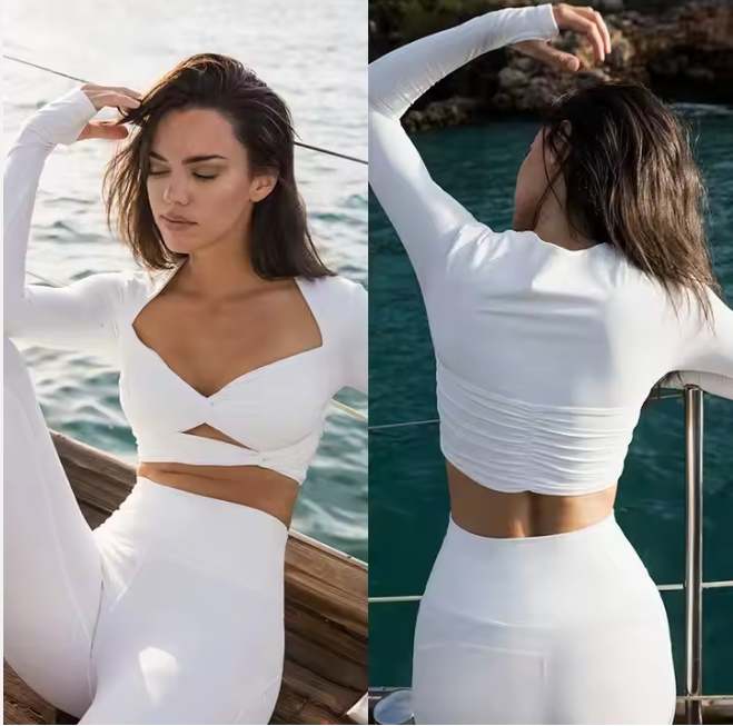 Elevate your workout wardrobe with the Women’s Front Knot Long Sleeve Top with Legging Set, designed to bring comfort, style, and function together. The front knot design flatters your waistline while adding a fashionable twist to a classic long sleeve silhouette. Paired with high-waist leggings, this 2-piece set ensures a supportive and sculpted fit for any activity. Crafted from soft, breathable, and stretchable fabric, this outfit allows freedom of movement and keeps you dry throughout your yoga, fitness, or leisure sessions. Perfect for women who want to look stylish while staying active. Features: Trendy front knot detail for a flattering, modern look Long sleeve top with flexible, breathable design High-waist leggings for a comfortable, sculpted fit Moisture-wicking, quick-dry, and 4-way stretch fabric Ideal for yoga, gym, pilates, or casual wear 2-piece coordinated set